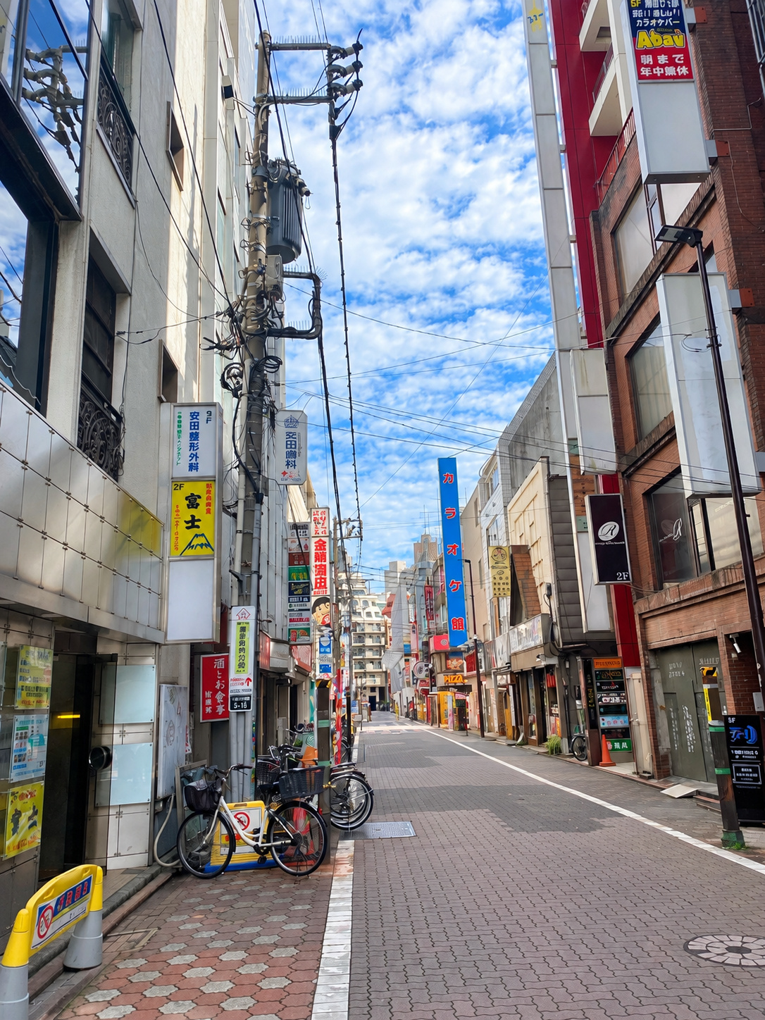 A street near Kamata Station lined with bars and shops
