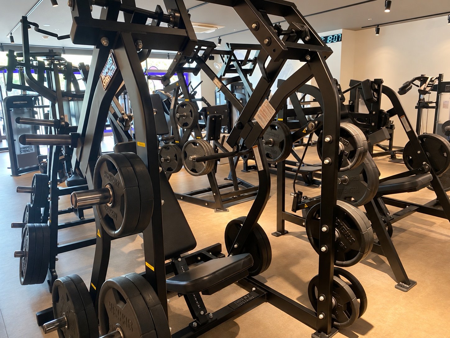 Rows of HAMMER STRENGTH plate-loaded machines at Anytime Fitness Shinjuku-Tomihisacho