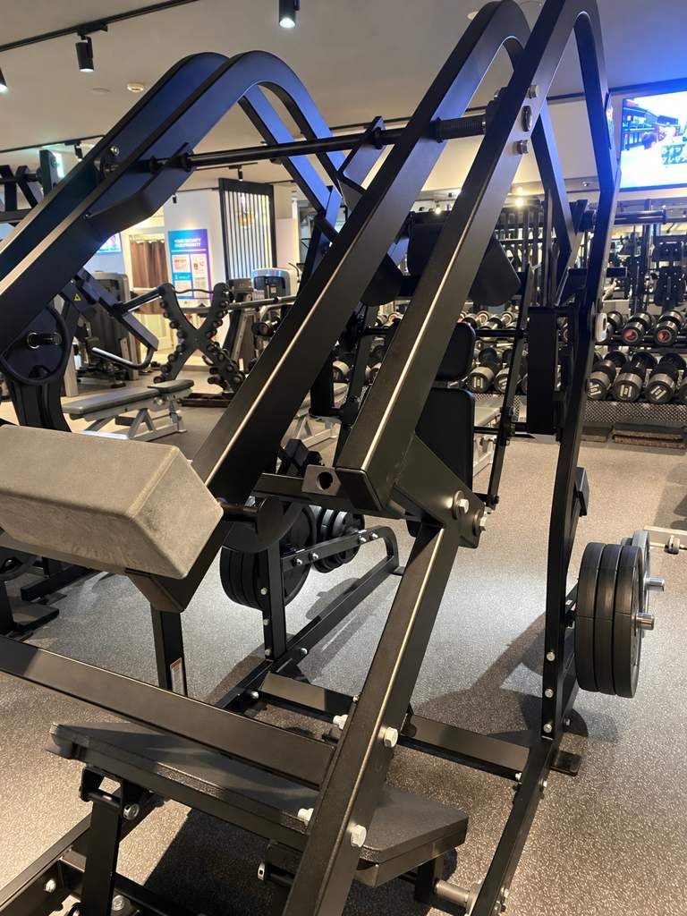 Plate-loaded machine and dumbbell rack at Anytime Fitness Shin-Shibamata